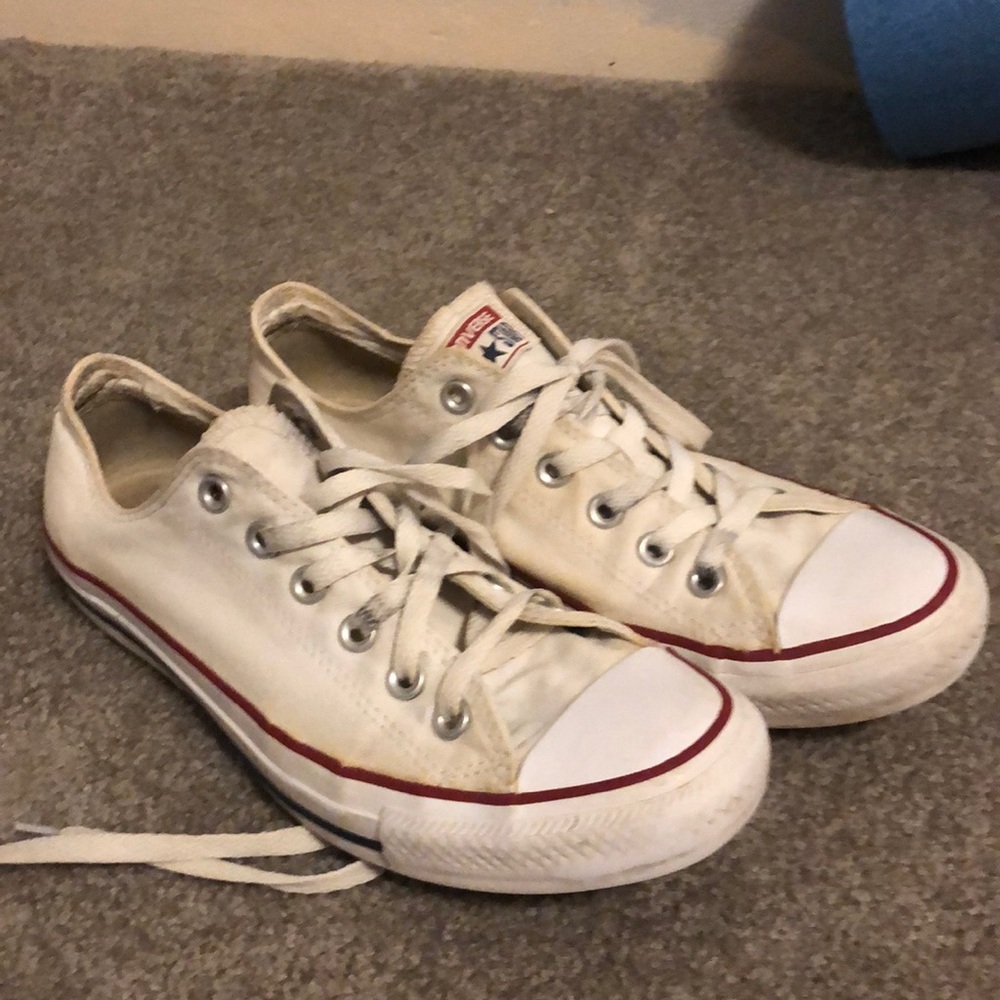 Used white low top converse.